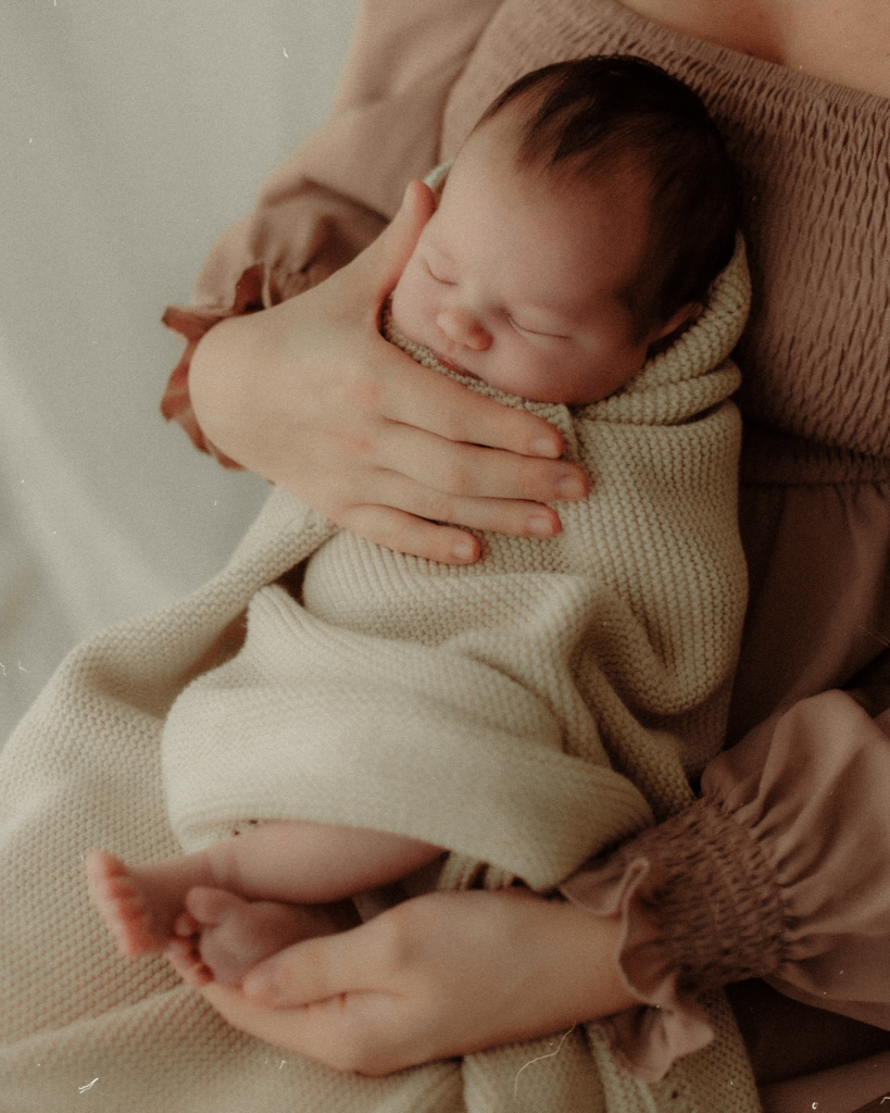cotswold newborn photographer taking photos of a sleeping newborn baby